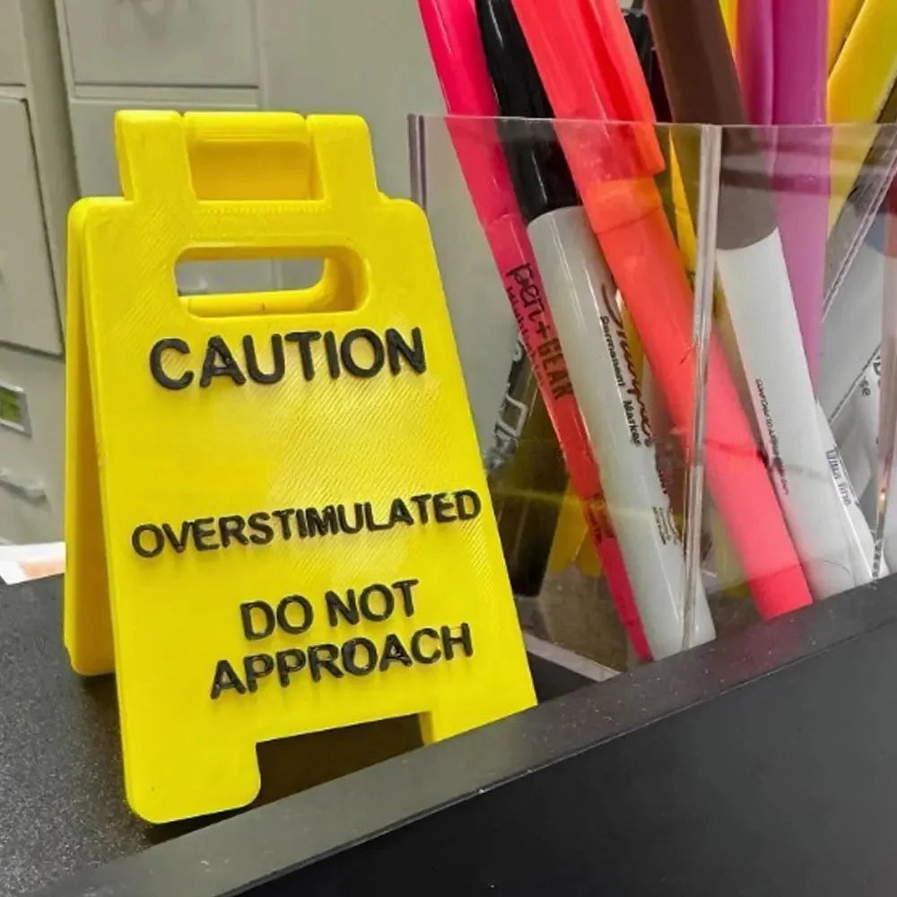 Overstimulated Office Desk Sign