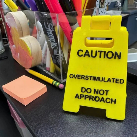 Overstimulated Office Desk Sign