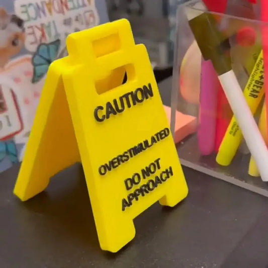 Overstimulated Office Desk Sign
